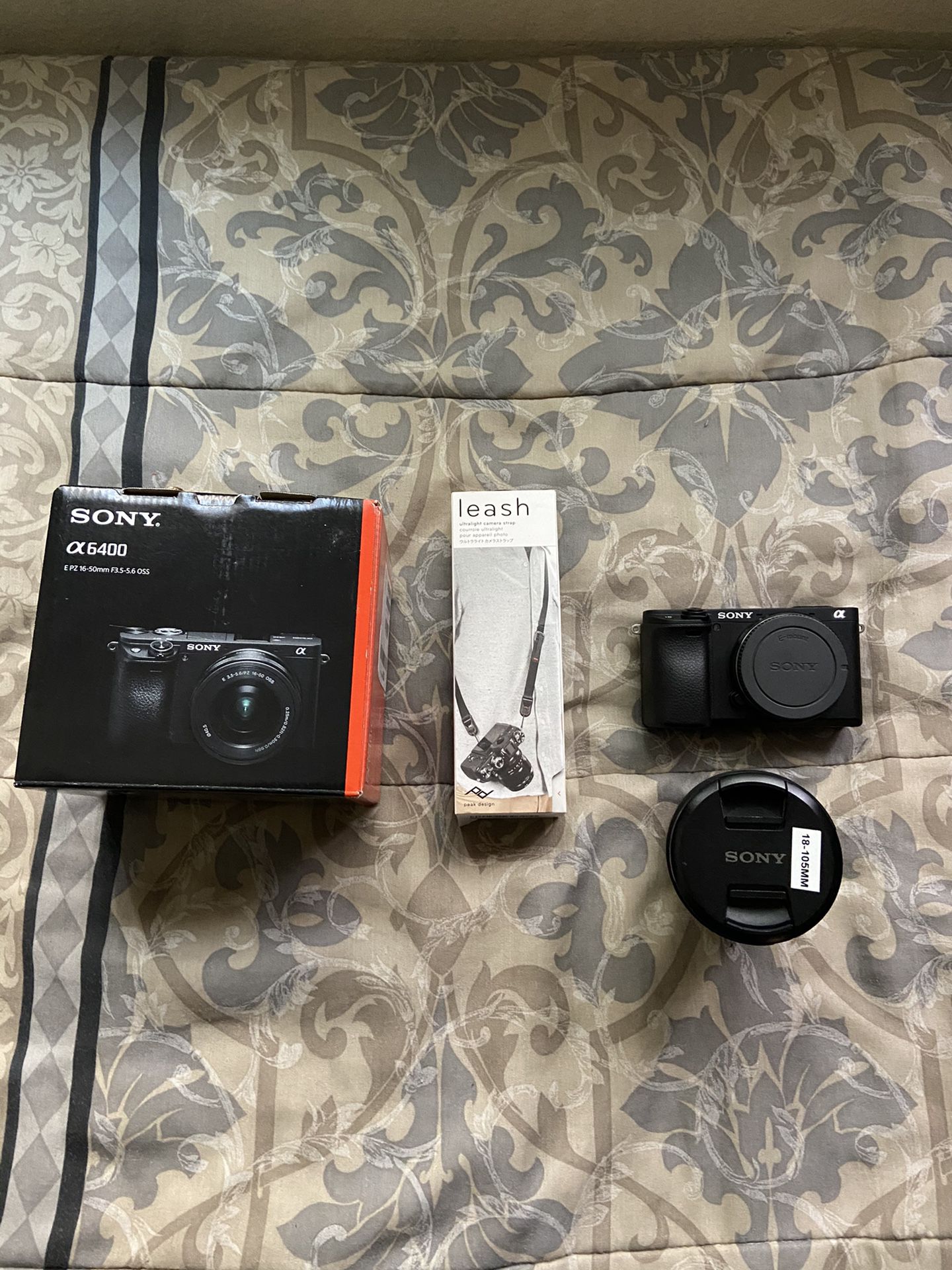 Sony a6400 with 18-105mm lens (like new condition)