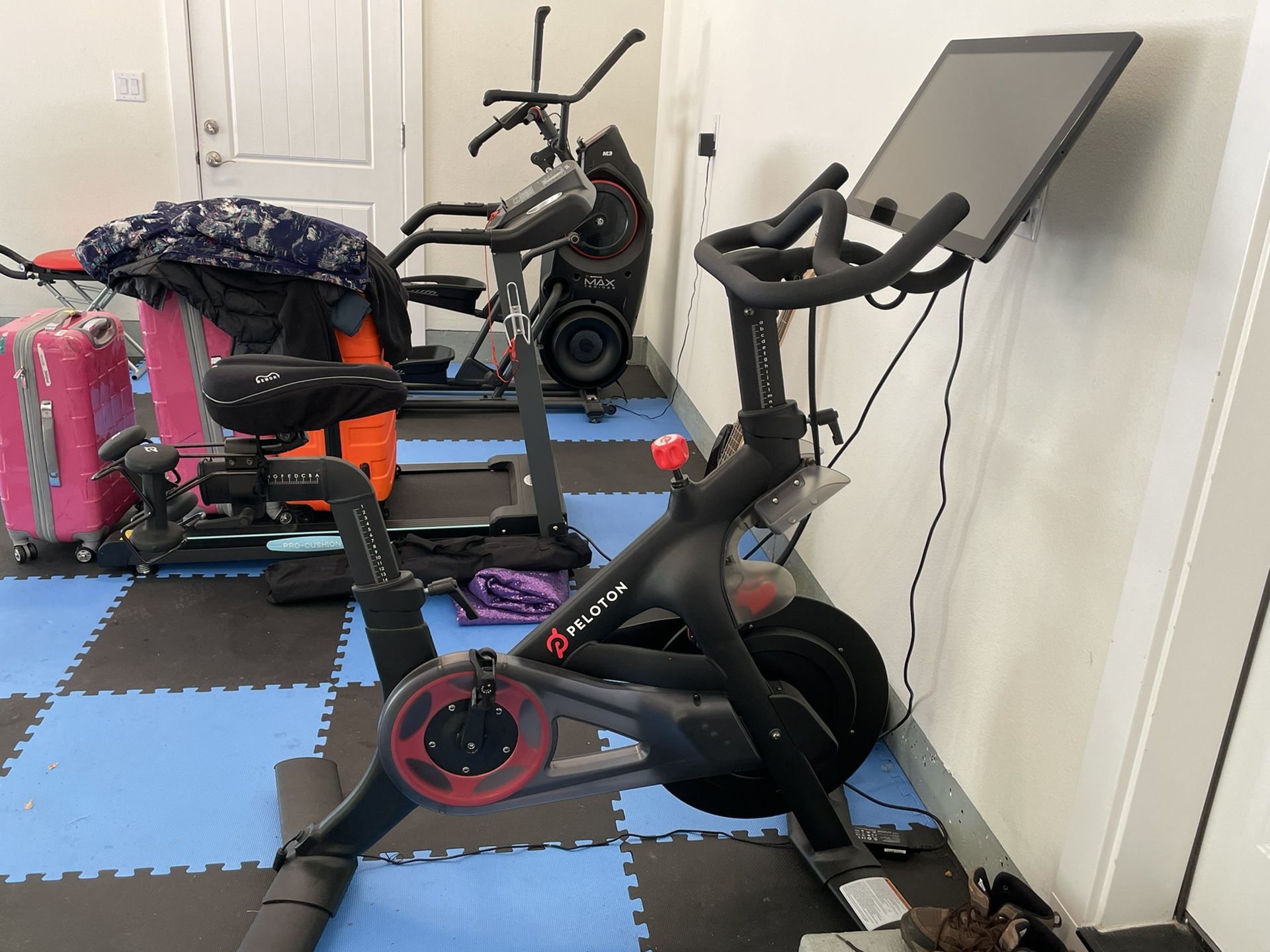 Peloton Bike, Includes two sets of shoes and weights