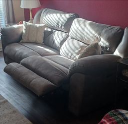 2 brown electric sofas