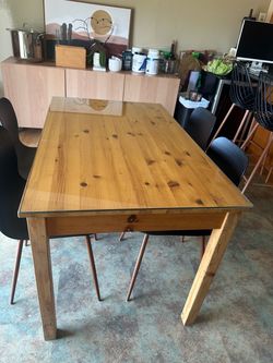 Solid wood table with glass top