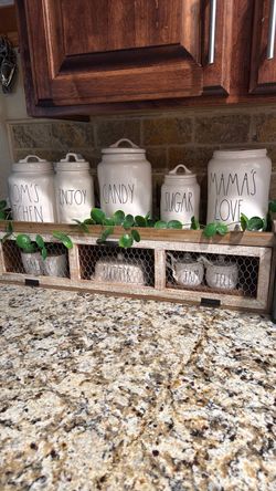 Rae Dunn canisters and display