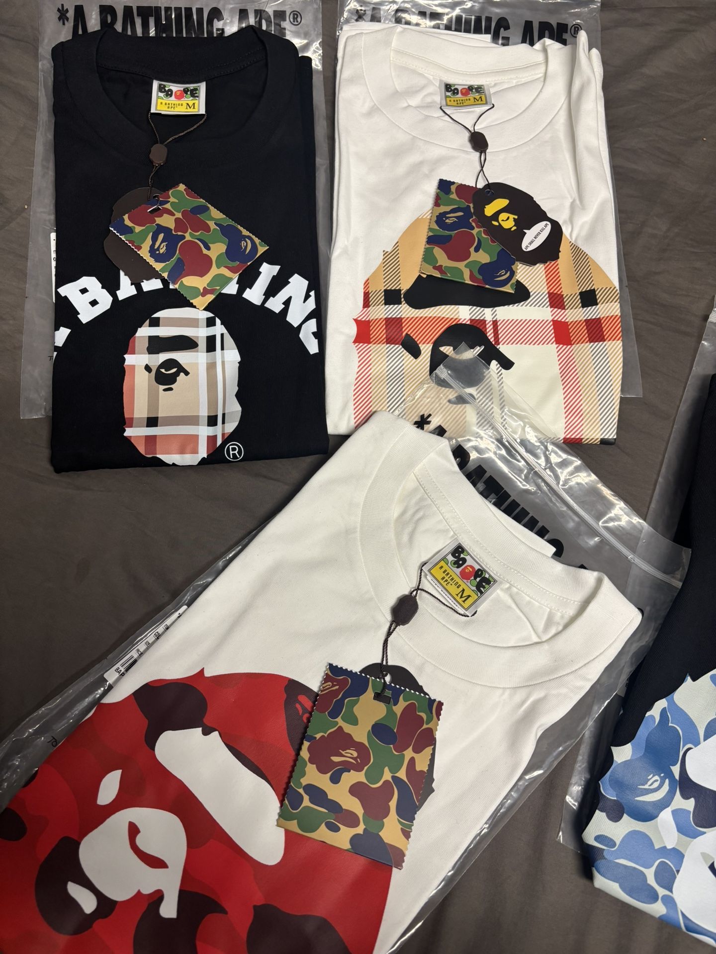 bape tees, essential shorts sweats sweaters ect spider