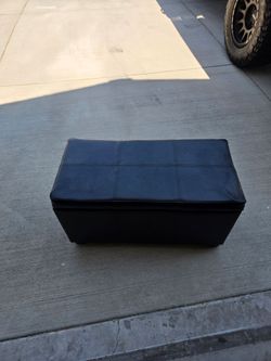 Black storage ottoman