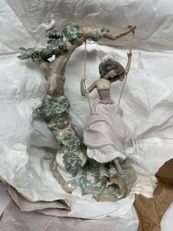 Lladro lady on swing