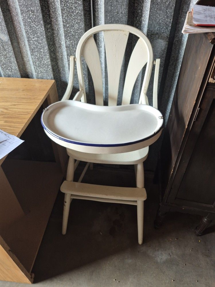 ANTIQUE HIGH CHAIR WITH THE LOCKS.
