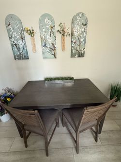 Table with chevron style chairs.