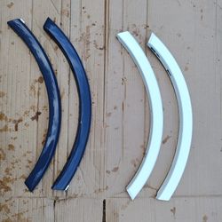 Two Pair Of Audi Fender Flares. One Painted White One Brand New