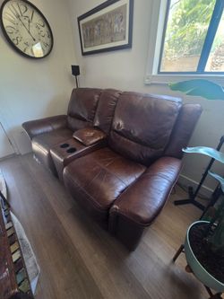 Electric reclining love seat and chair .