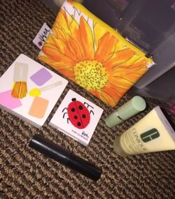 Brand new Clinique travel size makeup set with free bag