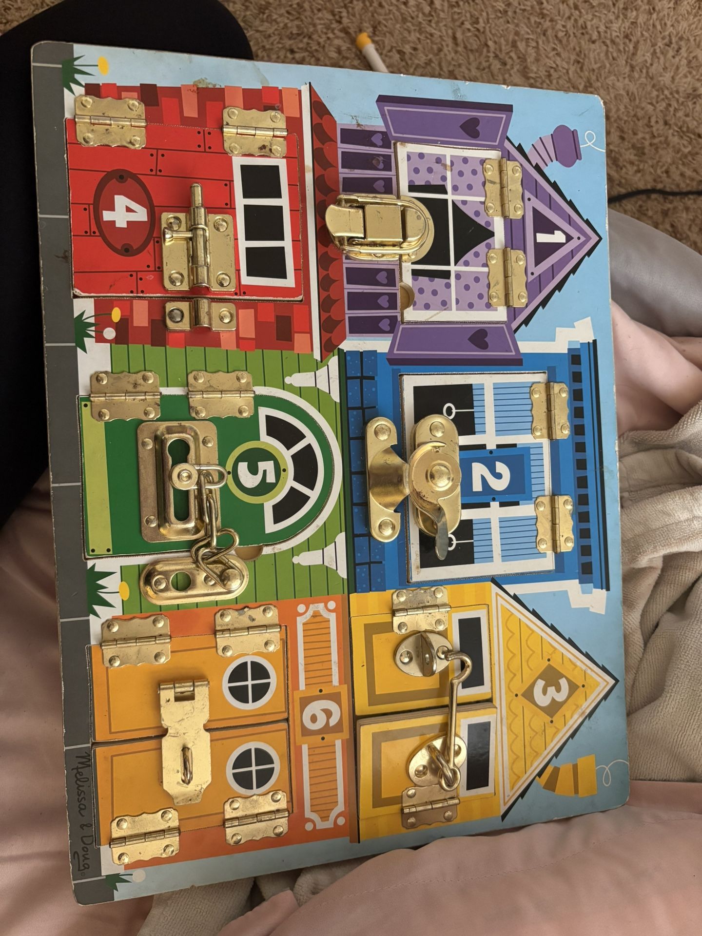 Melissa and Doug lock and latch sensory toy