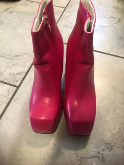 Woman’s pink boots