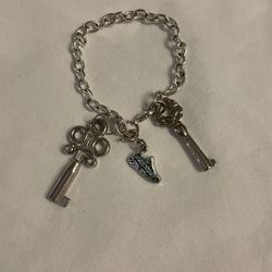 Silver Bracelet With 2Keys And A Sneaker $15