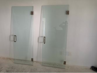 Use shower doors with hinges one glass door is 30” x 76” second glass door 28” x 76