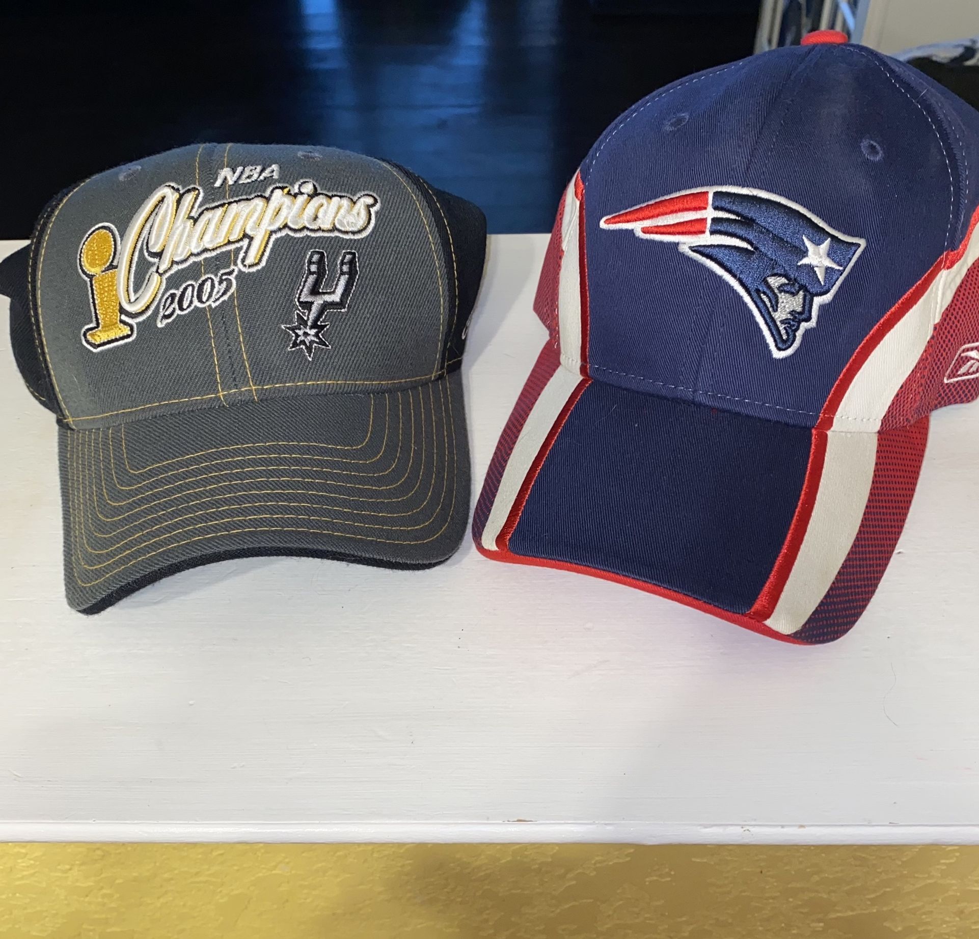 $10 Spurs and Patriots caps