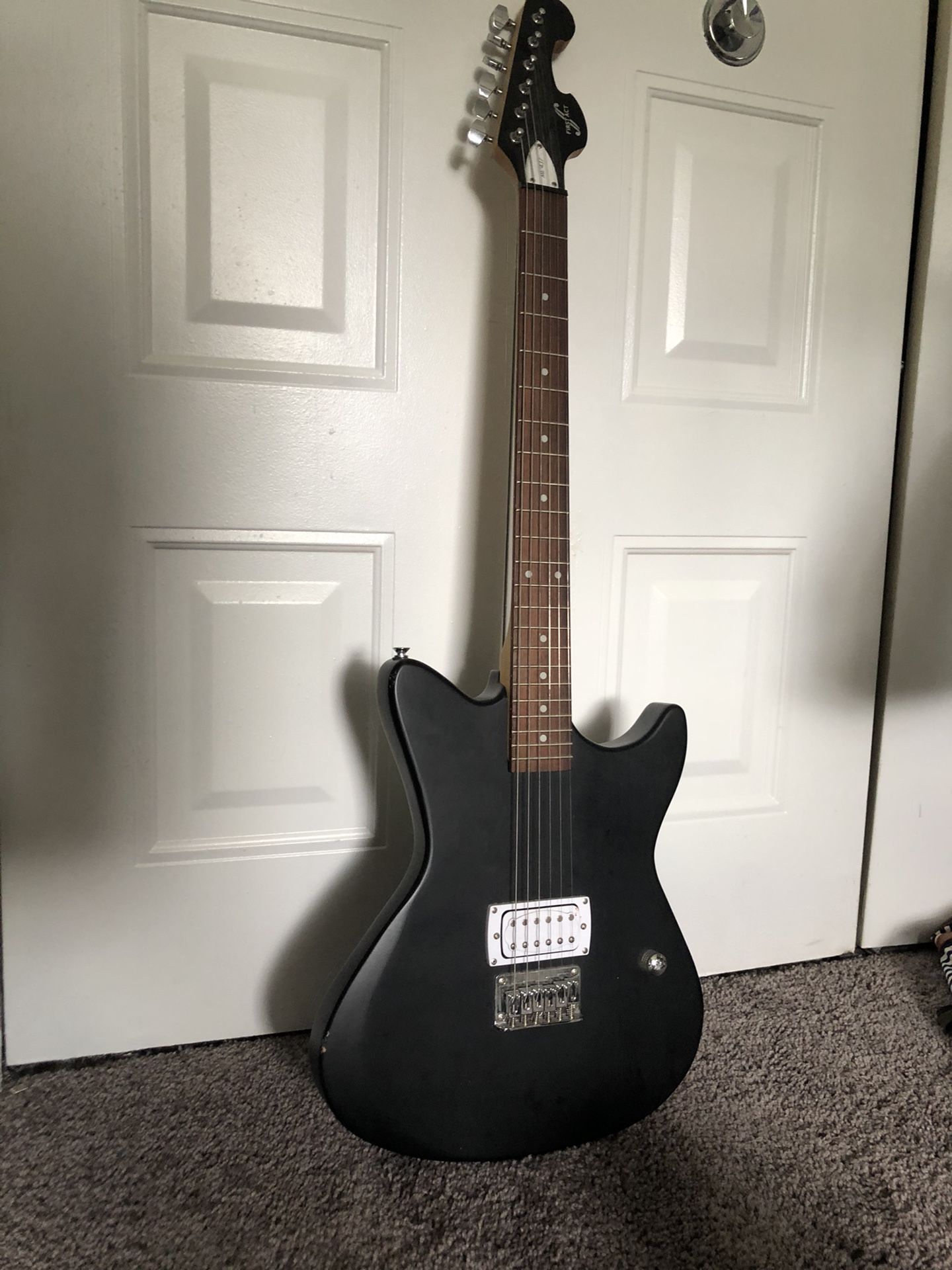 Black First Act Electric Guitar