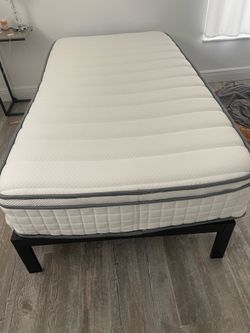 Twin bedd used for guests - 12” high frame