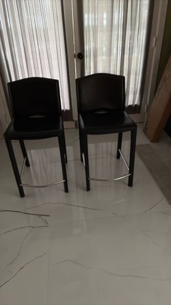 2 leather stools in good condition