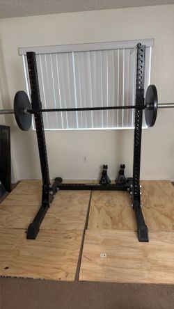 Rogue Adjustable Squat Rack weightlifting gym workout gear with two 45 lb plates included black good condition