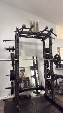 $2500 Rep Half Rack With Weights Spotter Arms And Bar
