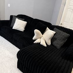 Black fluffy suede couch