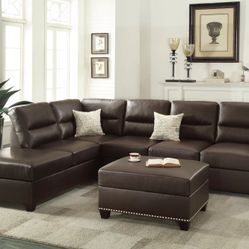 ESPRESSO FAUX LEATHER SECTIONAL WITH OTTOMAN. REVERSIBLE CHAISE