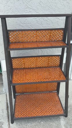 vintage boho-chic folding three-tier wicker and rattan shelf featuring a dark brown frame and woven basket-weave shelves.