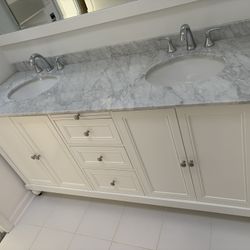 Double Vanity With Marble Top And Faucets