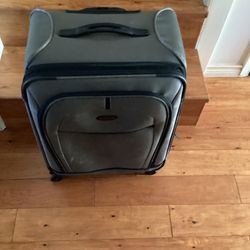 Samsonite  Luggage./ Suitcase(.Grey) Dimensions are;  17-1/2”W— 10”D — 24”H.  