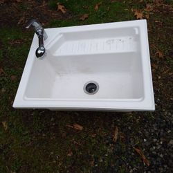 LAUNDRY. SINK. WITH SPRAY WAND FAUCET
