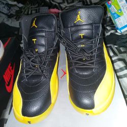 Black and yellow Jordan 12s