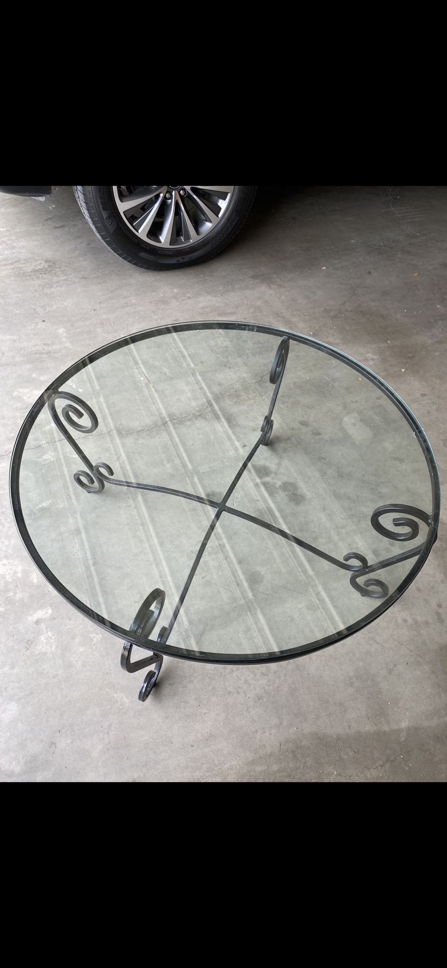 Iron and glass coffee table for sale! 36”L X 17” H.
