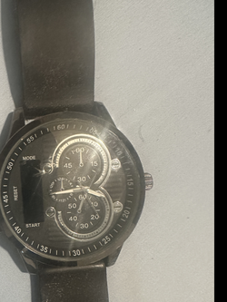 Fastrack model FMDMO174 with a round, large face and a black silicone band