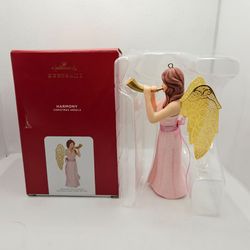 New Hallmark Ornament 2021 HARMONY Christmas Angels Series Angel playing dress

Brand new Ornament,  never displayed 
Box has some storage wear, damag