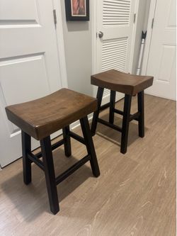 Two heavy bar stools from Ashley’s furniture store