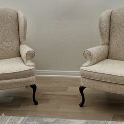 Cream floral wingback accent chairs