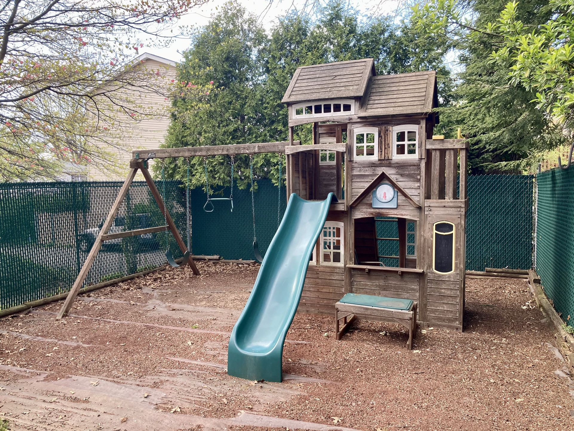 Outdoor Playhouse With A Swing Set