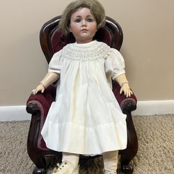 Antique Porcelain Doll with Chair