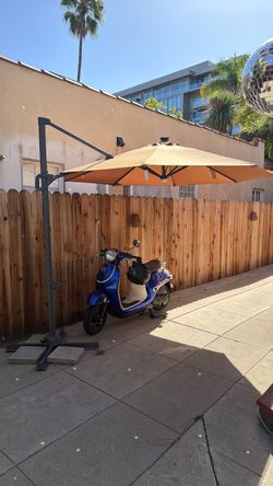 Foldable standing umbrella with solar lights