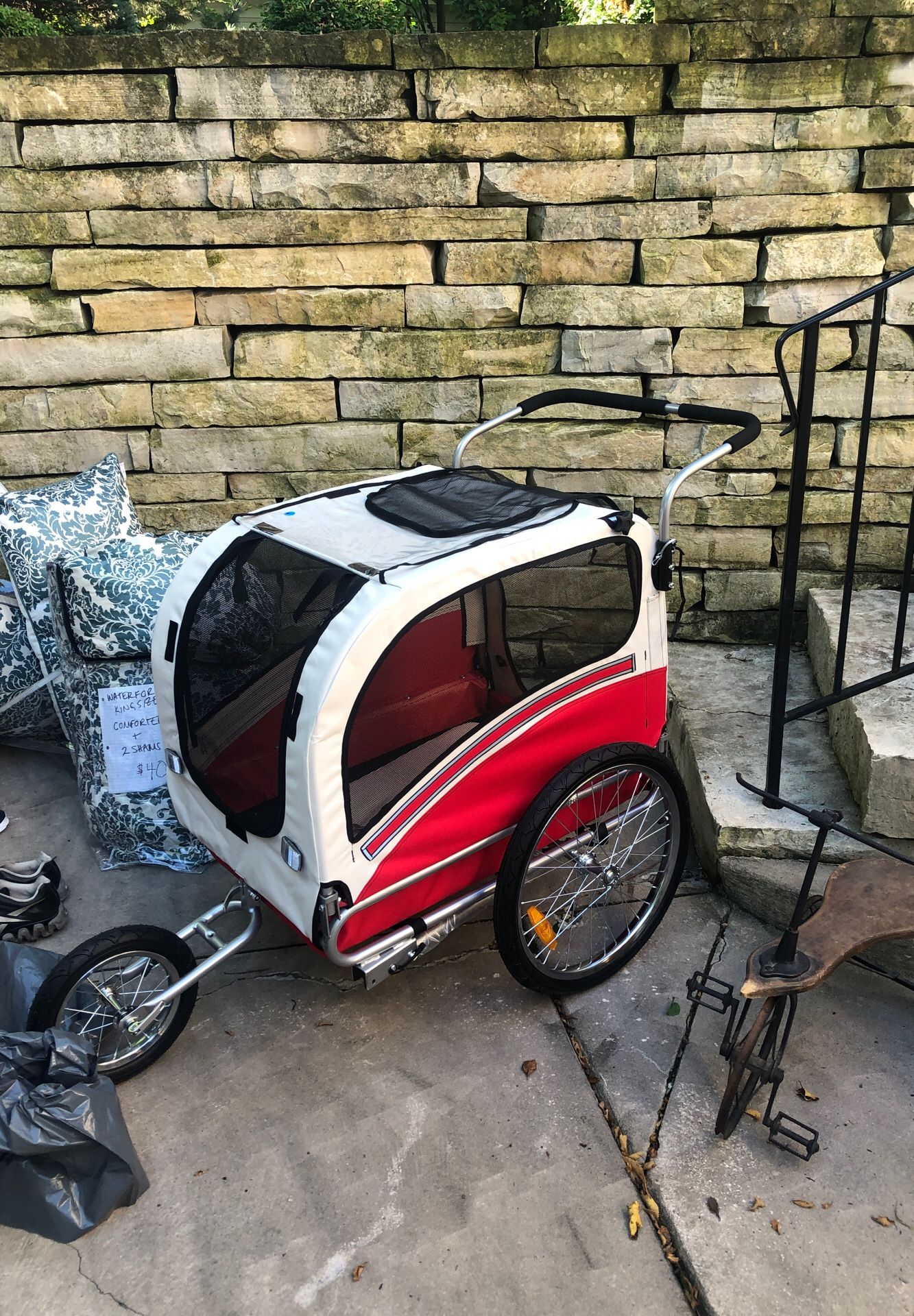 Dog stroller has bike attachments