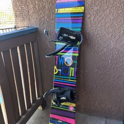 Snowboard, Snowboard Boots, And Board Waxing Kit 