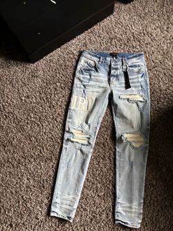 Amiri Light Wash Distressed Skinny Jeans