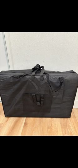 Black massage table with bag
