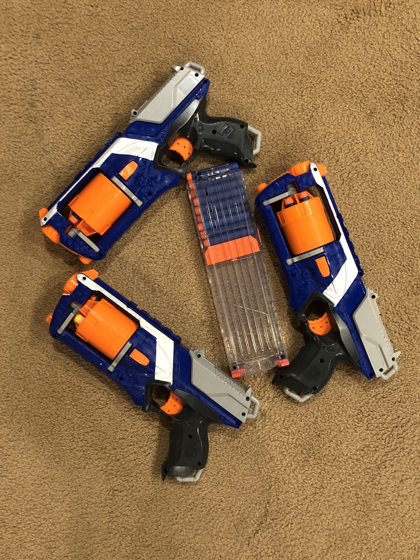 A Set Of Three Nerf Guns