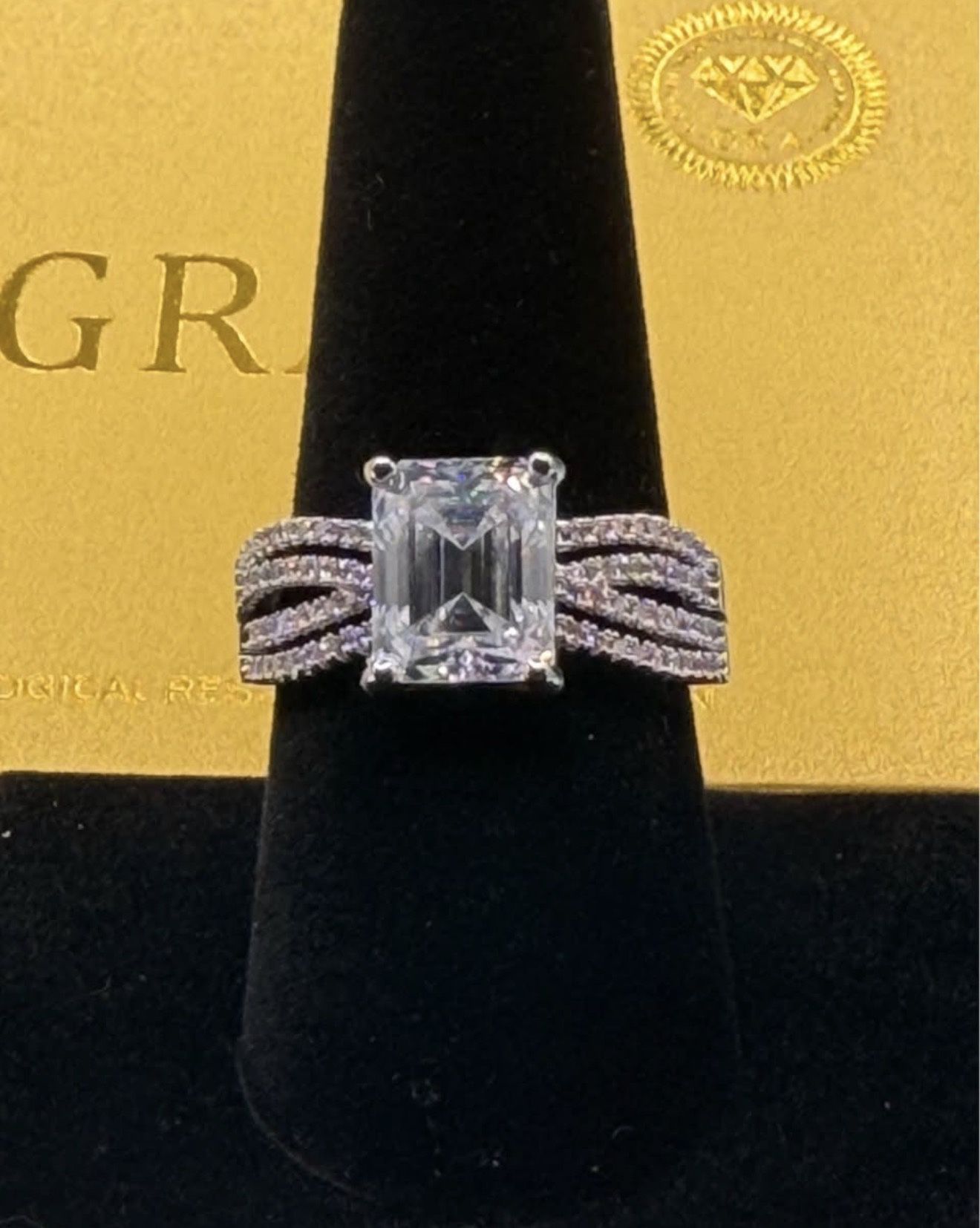 # 112 Stunning 4ct. Emerald Cut Moissanite Ring with Four Row Band Size 8 & 9 Available
