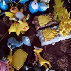 Around 60 Pokémon action figures toys and 13 books