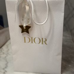 Dior empty bag with brand bow and metal golden star