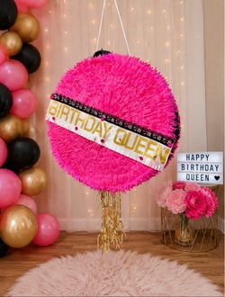 Happy Birthday Queen piñata decorated with pink Penis’s