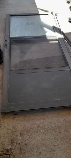 EXTERIOR DOOR METAL AND GLASS HAVE SCREEN..GOOD CONDITION