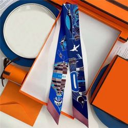 Polyester scarf with blue background featuring hot air balloons, birds, and geometric shapes No box