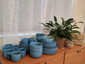 I'm selling an 8-piece dinnerware set, practically new. A few pieces were used. $30